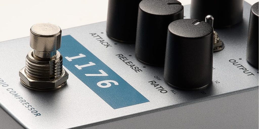 Universal Audio UAFX 1176 Studio Compressor effects pedal with control knobs and input/output jacks on a display stand.