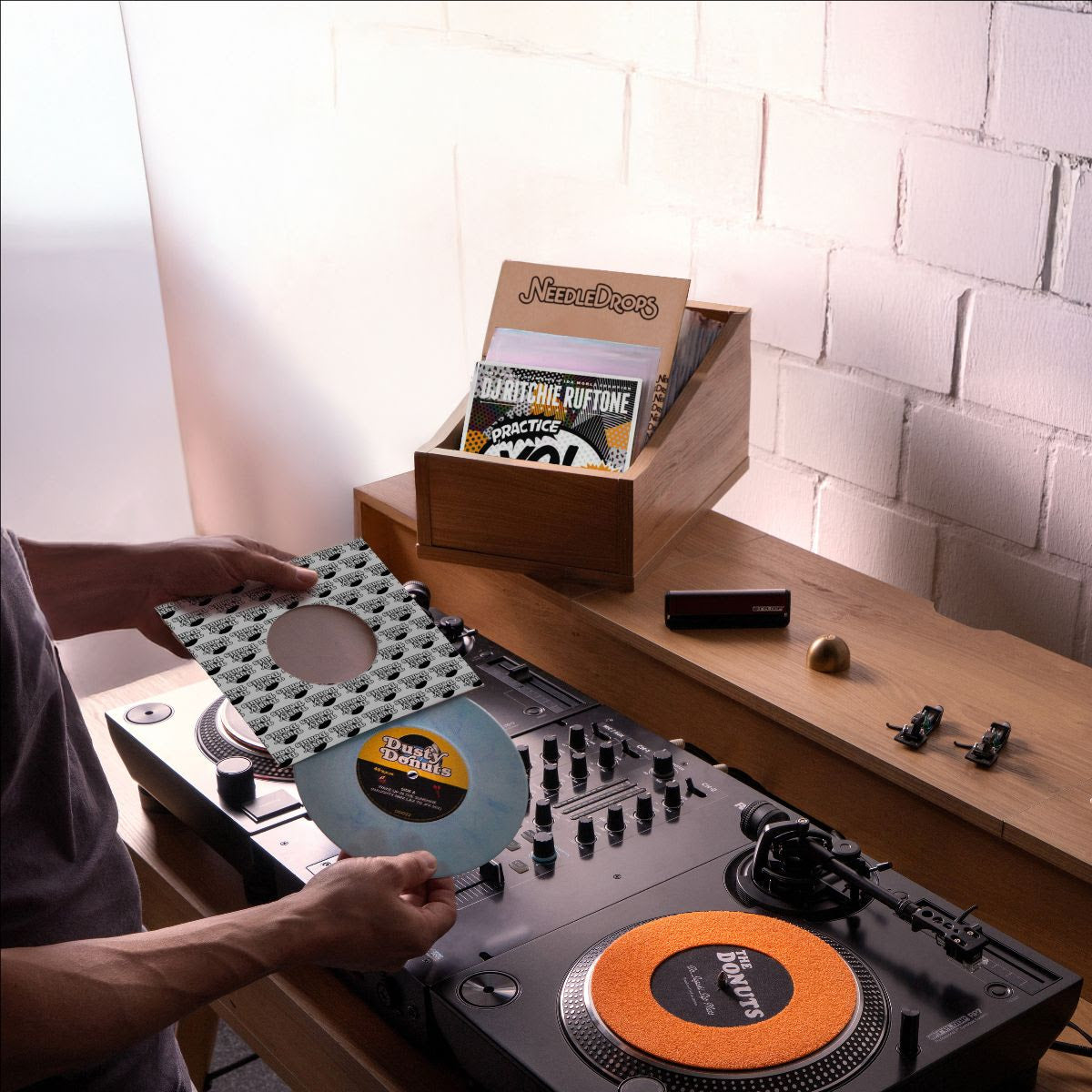 Reloop RP-7 DJ turntable with a sleek black platter, tonearm, and control knobs, designed for professional DJ setups.