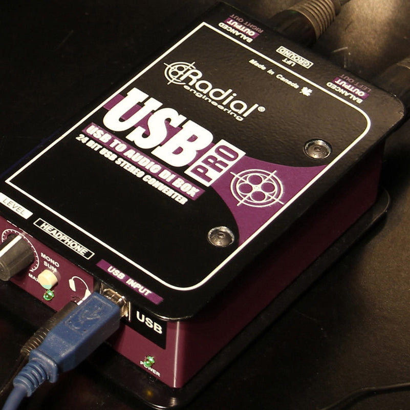Radial Engineering USB-Pro DI box for professional audio and USB signal conversion, shown in a sleek black design.