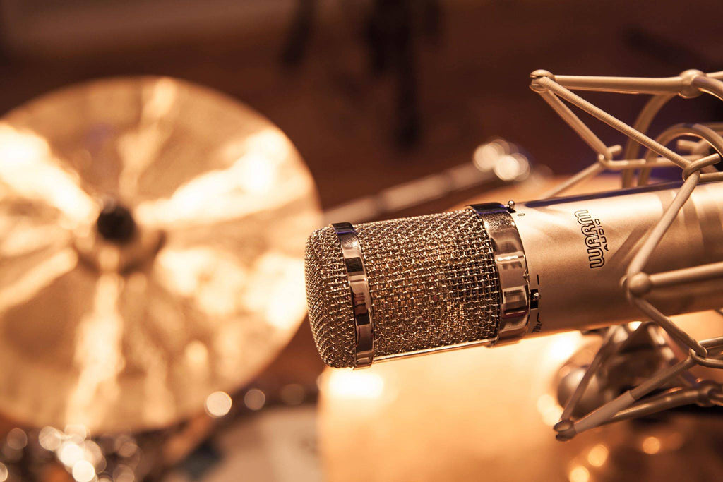 Warm Audio WA-47jr condenser microphone with vintage-style design and built-in shock mount, ideal for studio recording.
