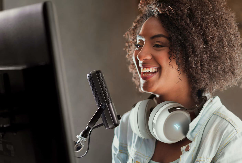 Black Elgato Wave:3 USB microphone on a desktop, showing the sleek design and compact build of the popular streaming microphone.