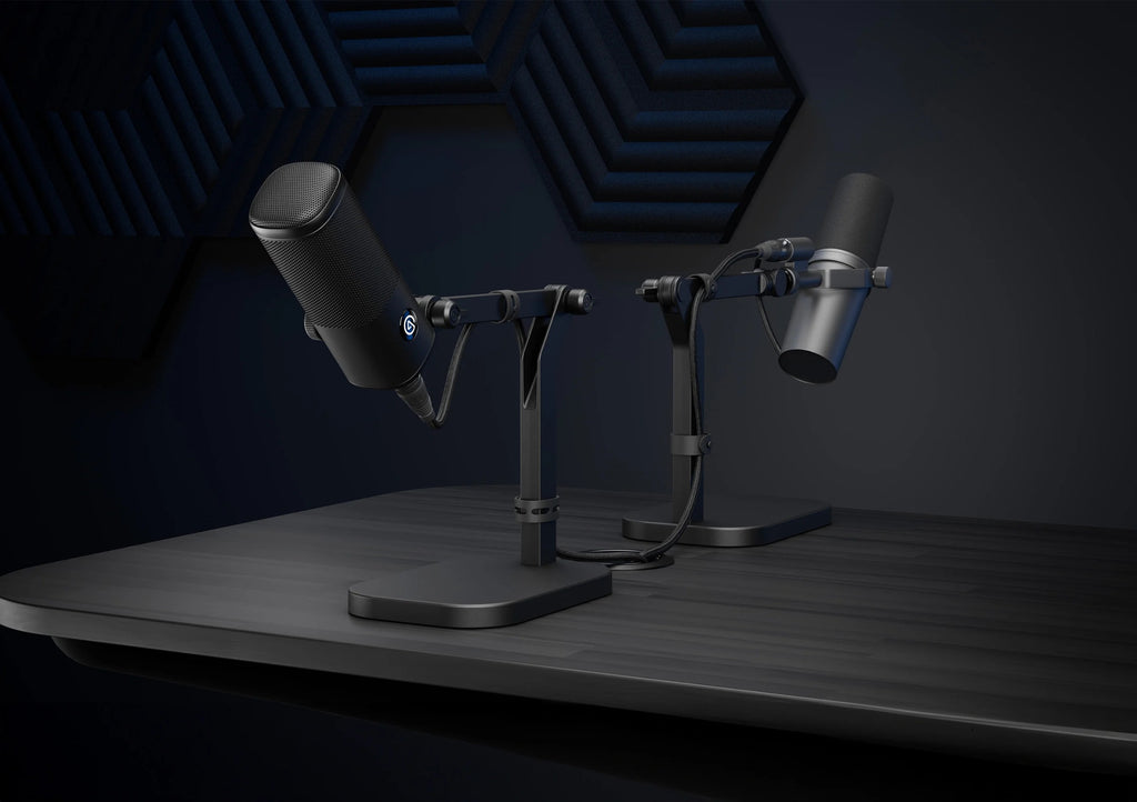 Elgato Wave Desk Stand holding a desktop microphone on a workspace with a computer and accessories.