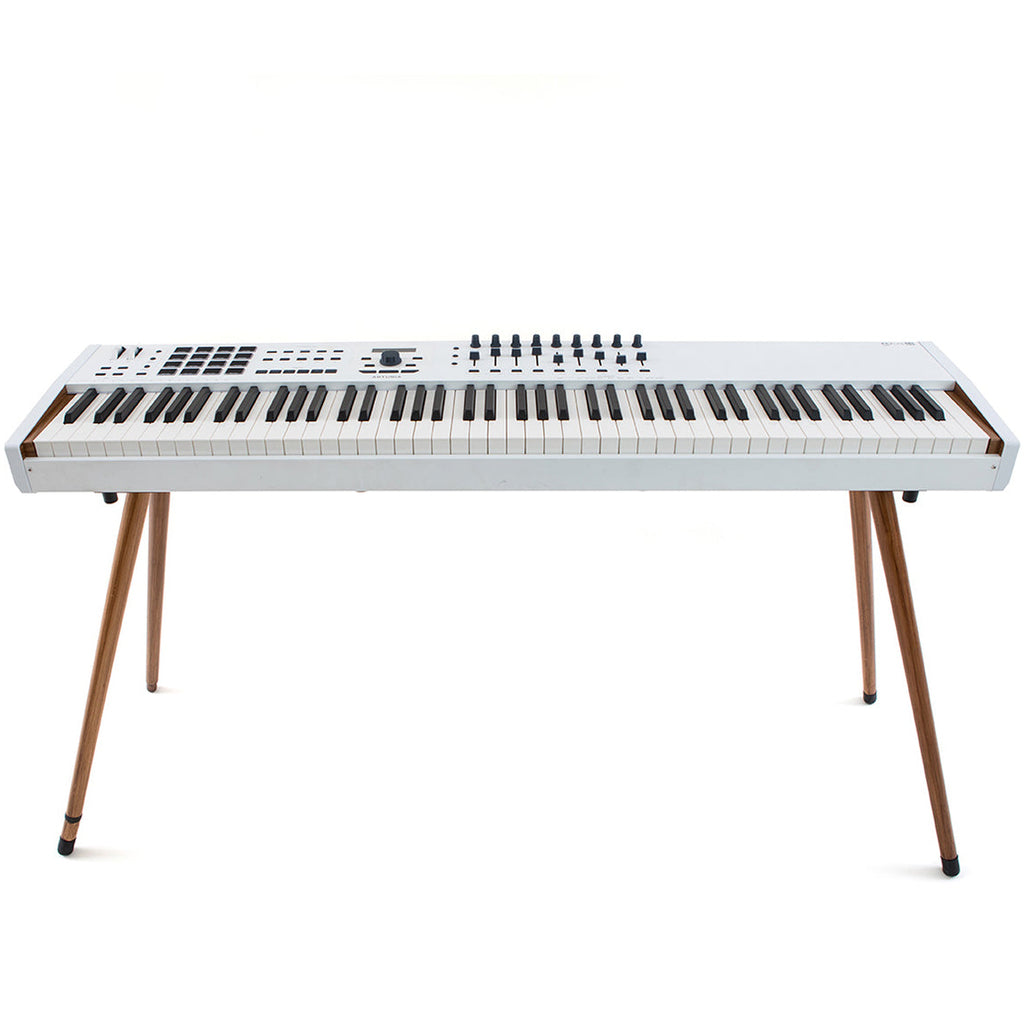 Arturia wooden legs for Keylab 88 MK2 and Polybrute, showcasing rich wood grain and sturdy design for keyboard support.