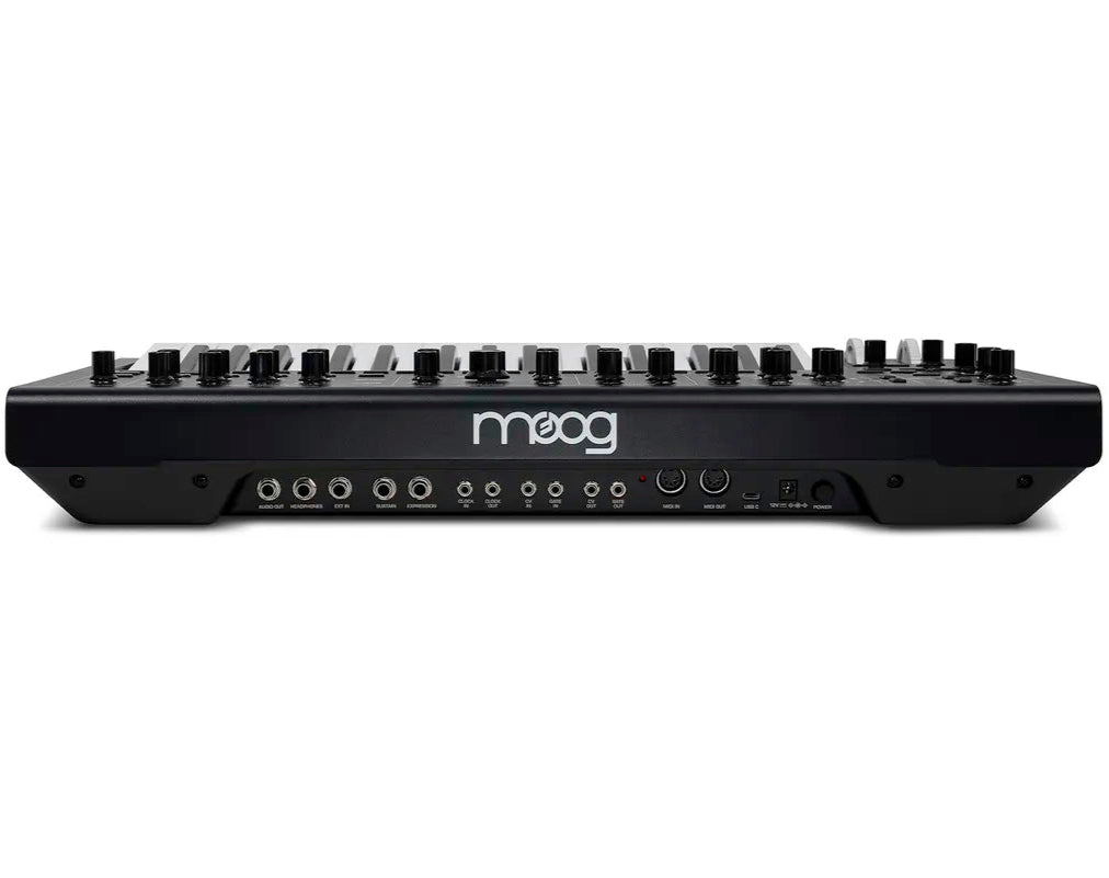 Moog Messenger synthesizer with keyboard and control knobs, compact black design, and vintage-style interface.