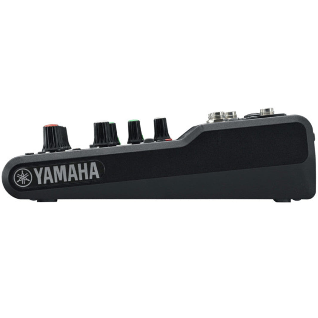 Yamaha MG06 analog mixer with two channels, knobs, and input jacks for audio mixing and sound control.