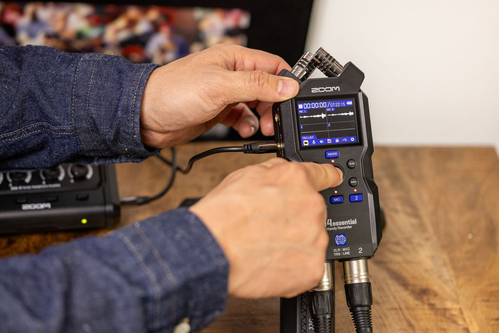 Zoom H4essential handheld audio recorder, lifestyle setup in black