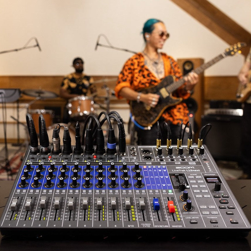 Zoom LiveTrak L12next digital mixer with multiple input channels, control knobs, and a compact design for live sound and recording.